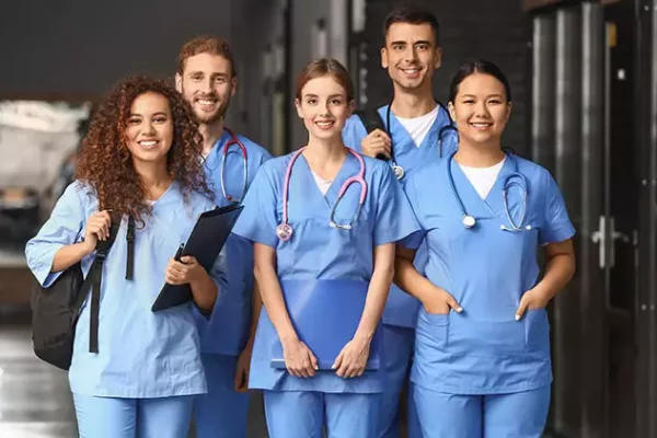 group-of-travel-nurses-smiling-together-704x421
